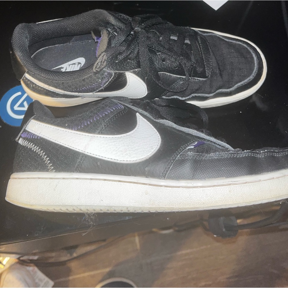 Black and Purple nike court vision lows